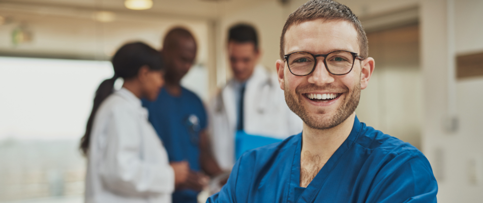 Image of healthcare professional smiling in a medical setting.